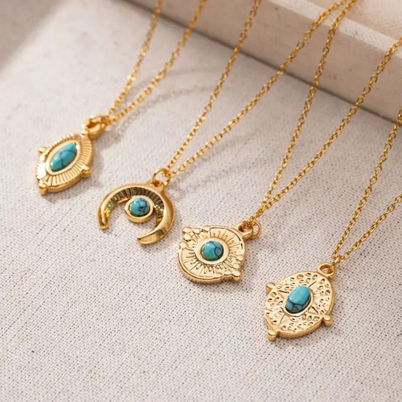 FY’s gold oval bead necklace with intricate vintage texture, styled with a black evening gown for royal-inspired elegance.