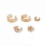 FY’s gold openwork ear cuff styled on a helix, paired with minimalist hoops for edgy everyday elegance.
