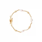 FY’s gold freshwater pearl bracelet styled three ways: wrist, layered, and ankle chain for versatile elegance.