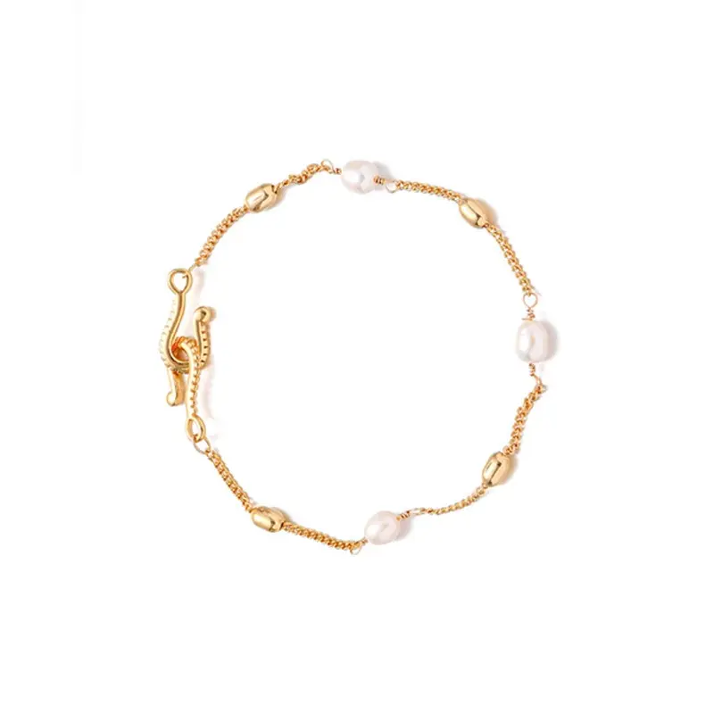 FY’s gold freshwater pearl bracelet styled three ways: wrist, layered, and ankle chain for versatile elegance.