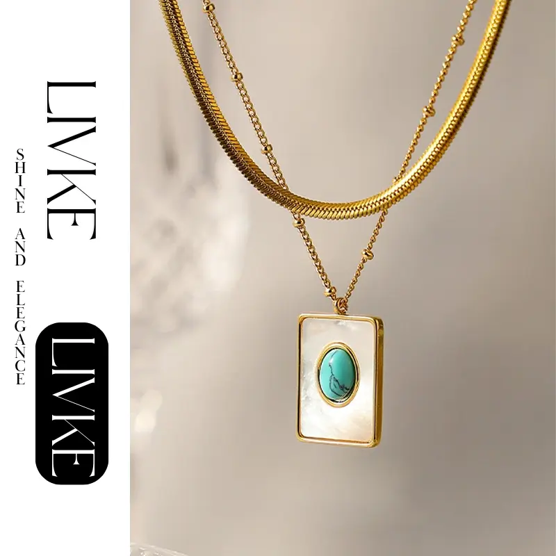FY’s gold snake chain necklace with shell and turquoise pendant, layered with beaded bracelets for boho summer style.