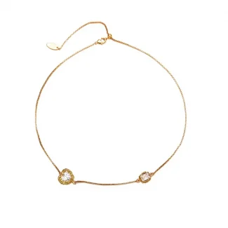 FY’s gold minimalist zirconia necklace styled with a white blouse for office-ready elegance.