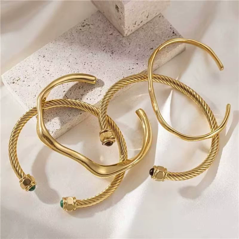 FY’s minimalist gold adjustable bangle bracelet styled with a white button-up for office elegance.