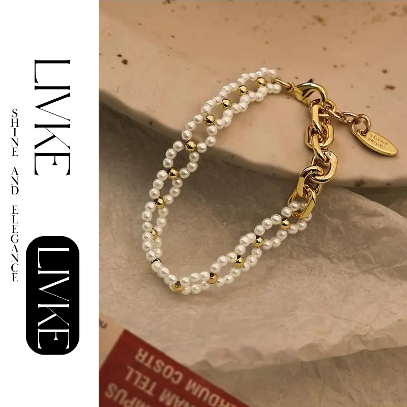 FY’s gold pearl chain bracelet styled on a wrist with a linen sleeve for boho everyday elegance.