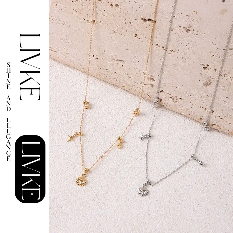 FY’s gold summer wave necklace with shell and zirconia pendant, styled with a straw hat for beachside elegance.