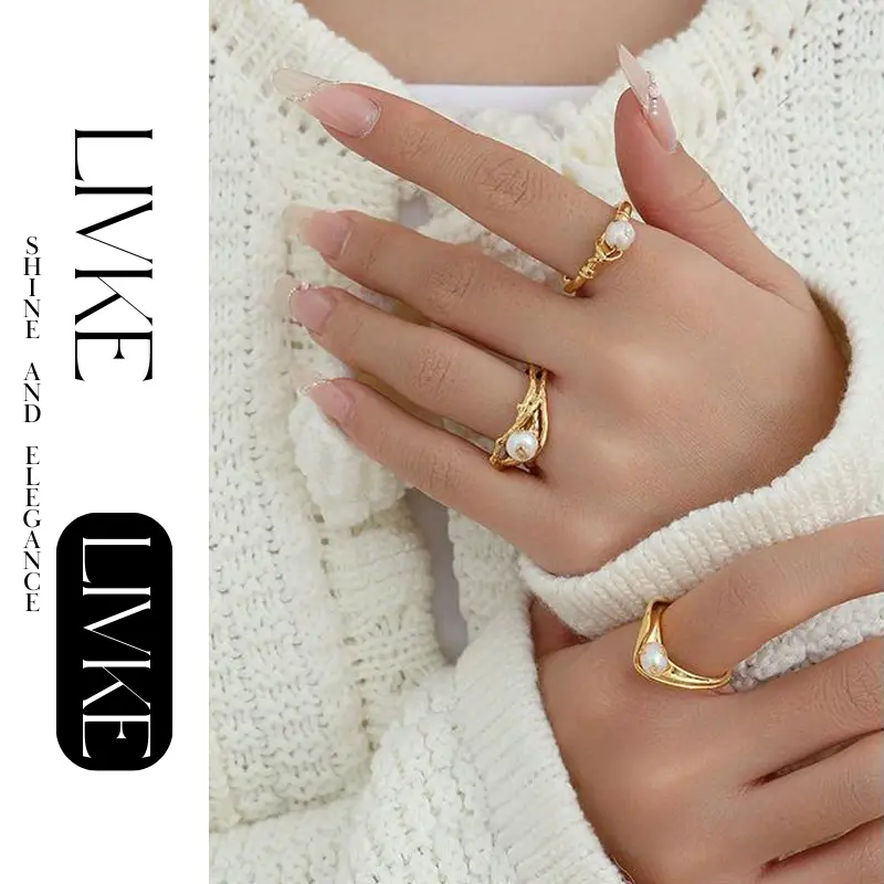 FY’s gold leaf and pearl adjustable ring on a hand with neutral nails, styled with a linen dress for effortless boho elegance.