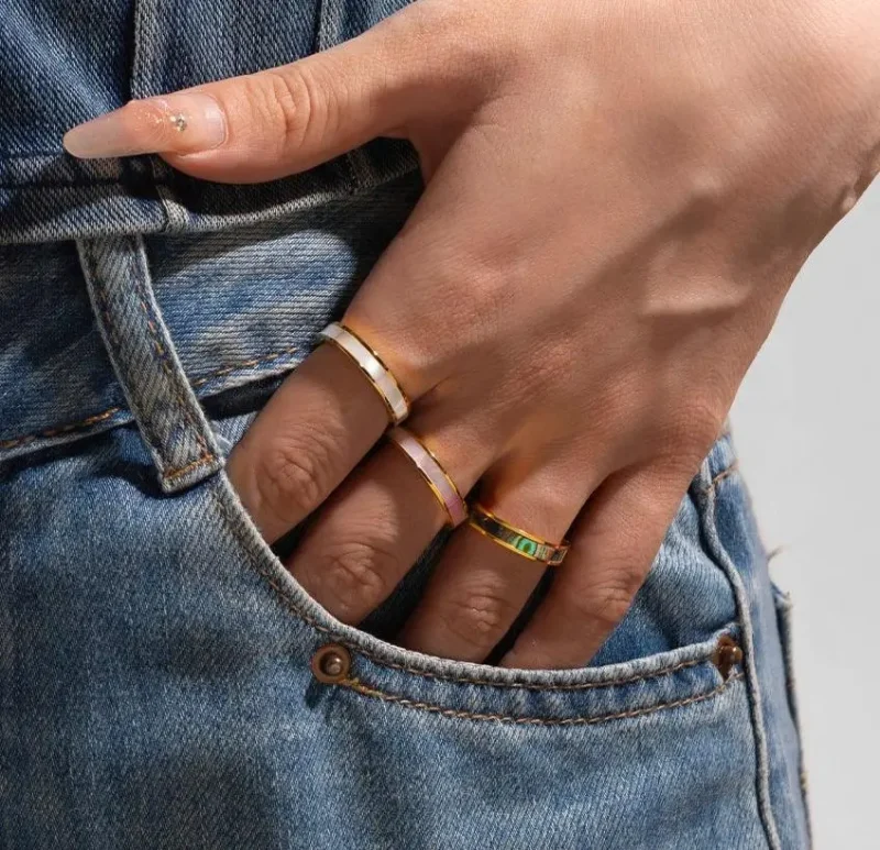 FY 18K gold-plated mother-of-pearl rings in three colors (white/pink/grey) stacked on finger with minimalist outfits