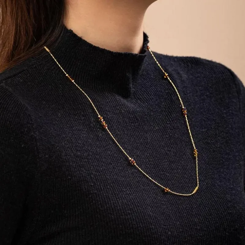 FY gold-plated adjustable tri-bead necklace styled as double layers with minimalist pendants, showing day-to-night versatility