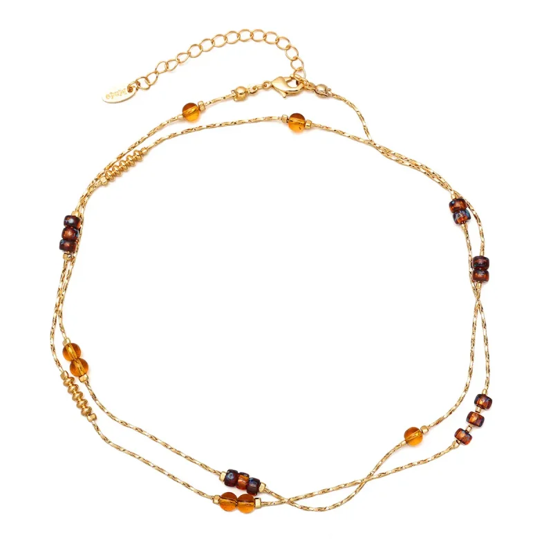 FY gold-plated adjustable tri-bead necklace styled as double layers with minimalist pendants, showing day-to-night versatility